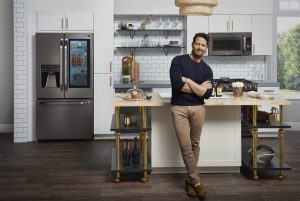man standing in his kitchen