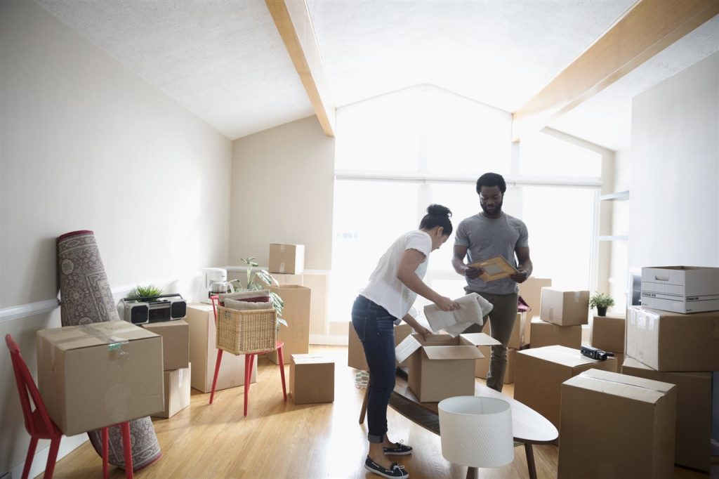 a couple putting things in a box | Chattanooga Home Inspector | Preventing Pests Chattanooga