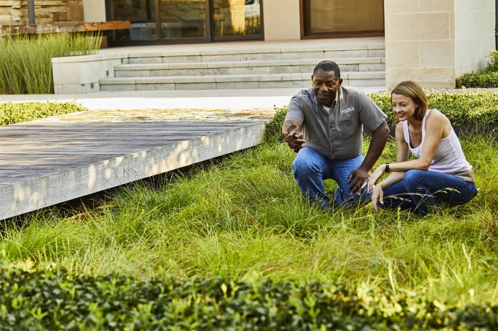 landscape contractor and homeowner in the lawn | Chattanooga Home Inspector | landscape professional Chattanooga