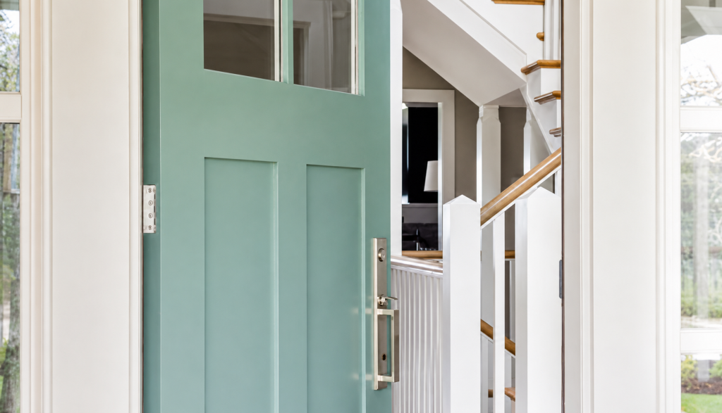 A home with a teal door.