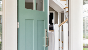 A home with a teal door.